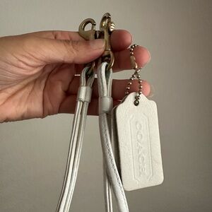 Coach bone hang tag and strap